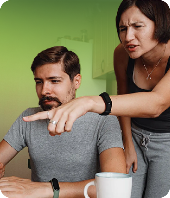 Women pointing at a laptop nad discussing something with a man
