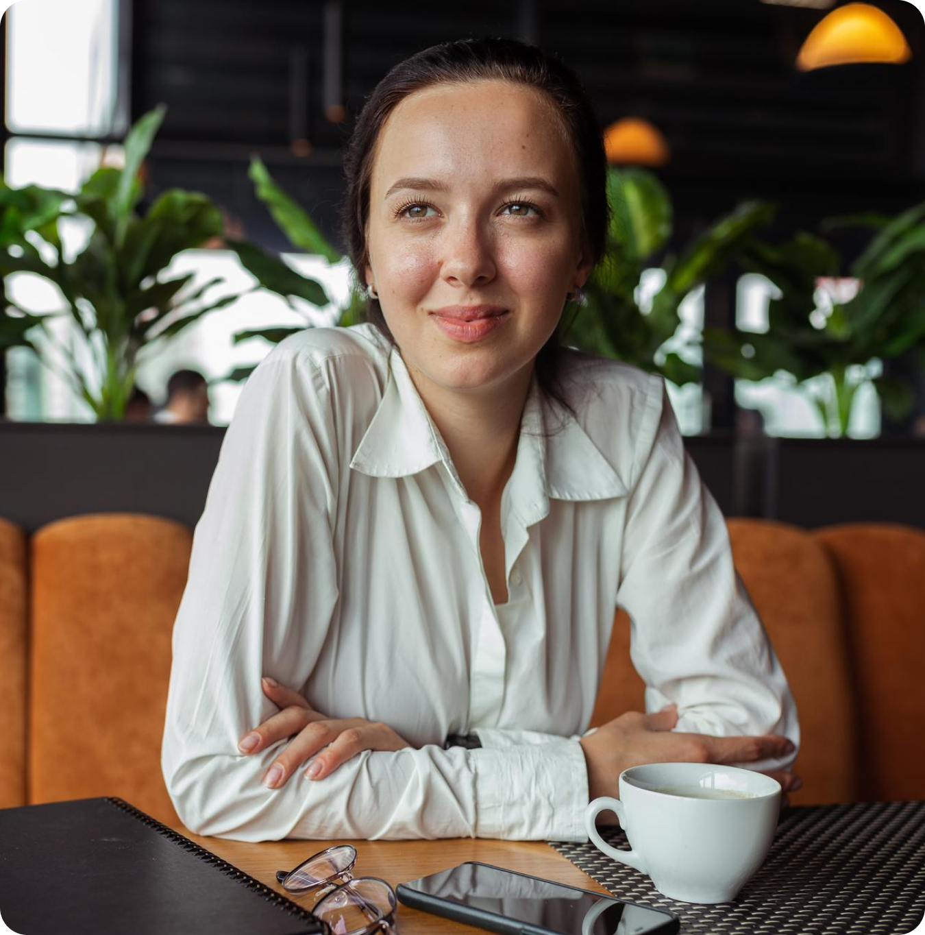 Woman smiling in a cafe