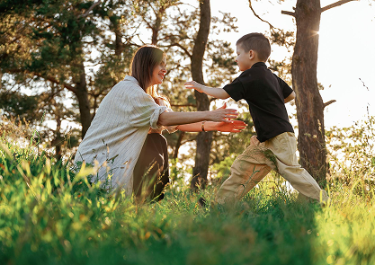 Boy running toward his mother