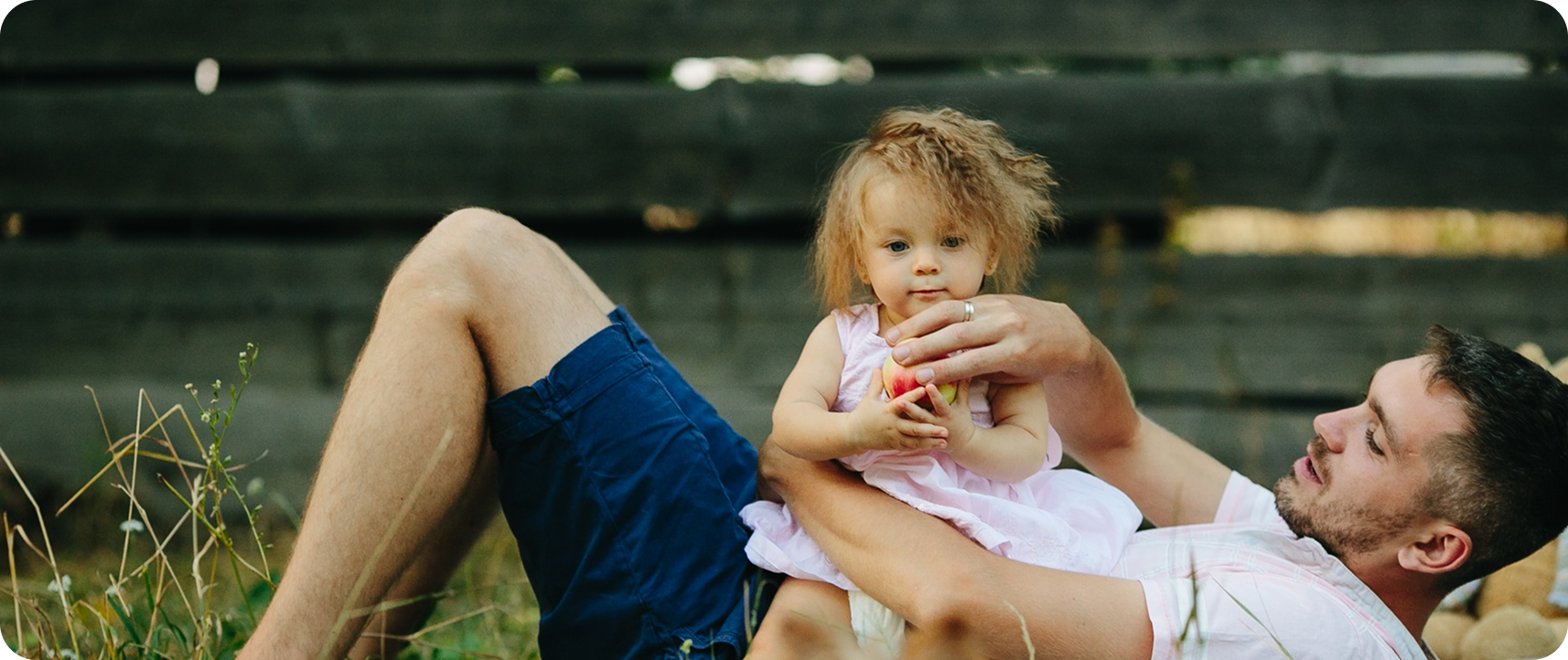 Father holding his child in a park