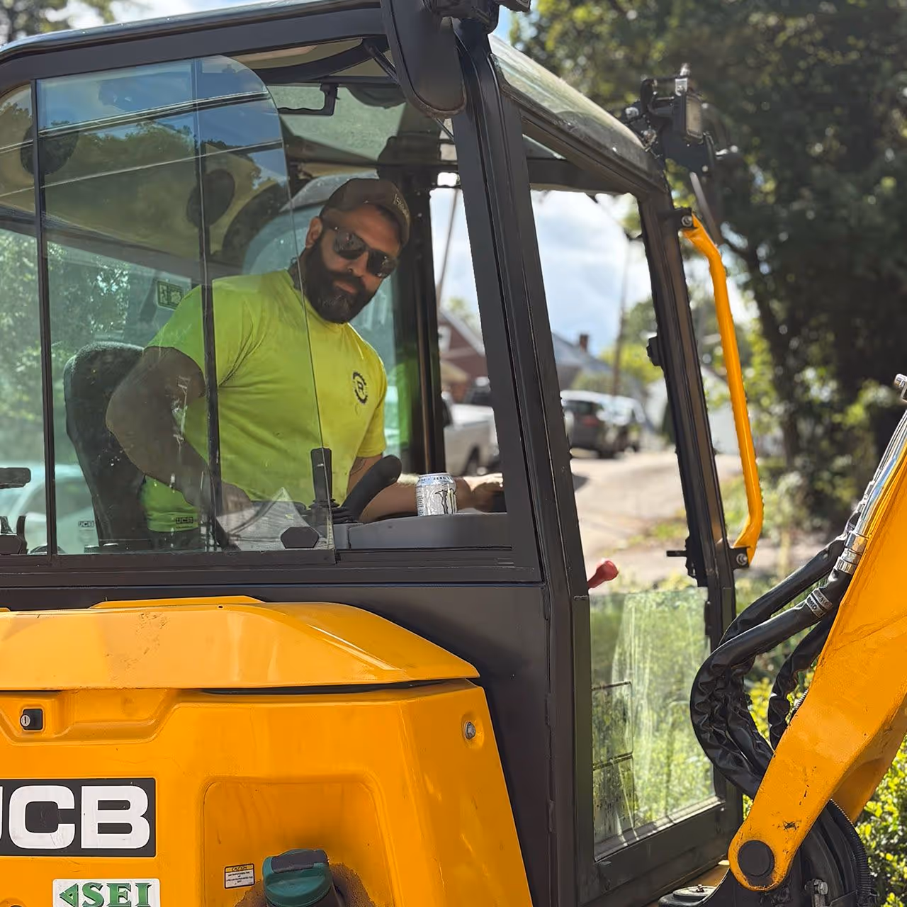 Excavator and heavy equipment preparing construction site by Roth Custom Solutions