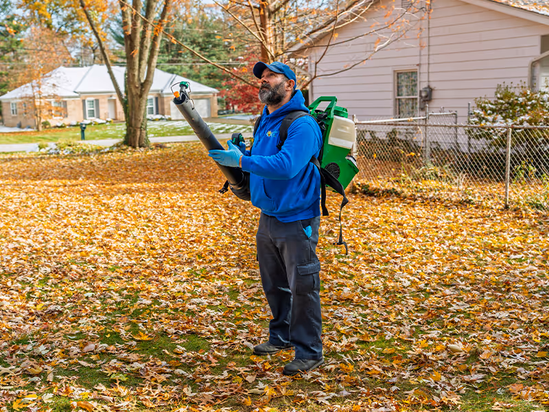 spraying an ohio yard for mosquitoes and ticks