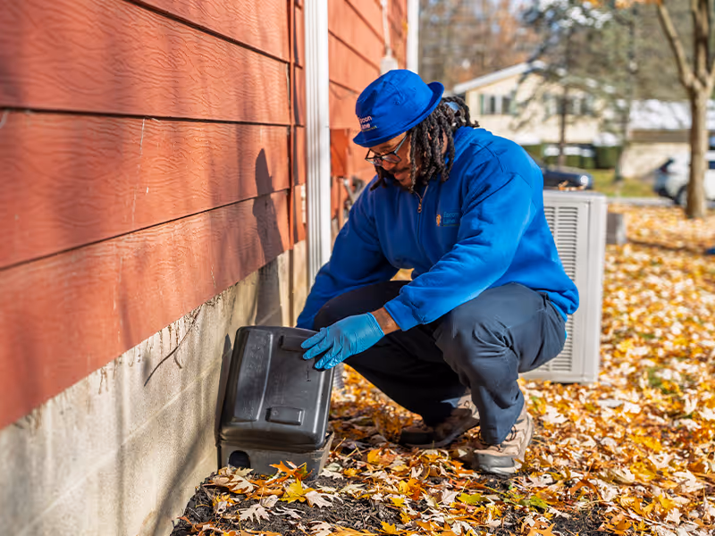 checking a rodent bait station at a cleveland residence