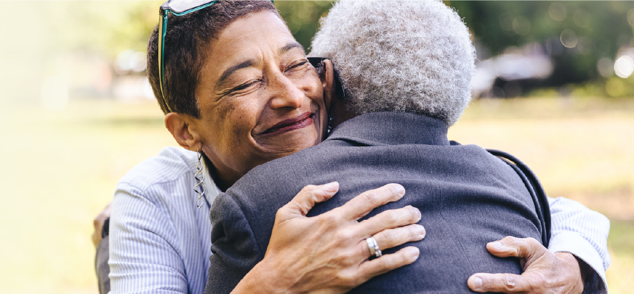 people hugging outside