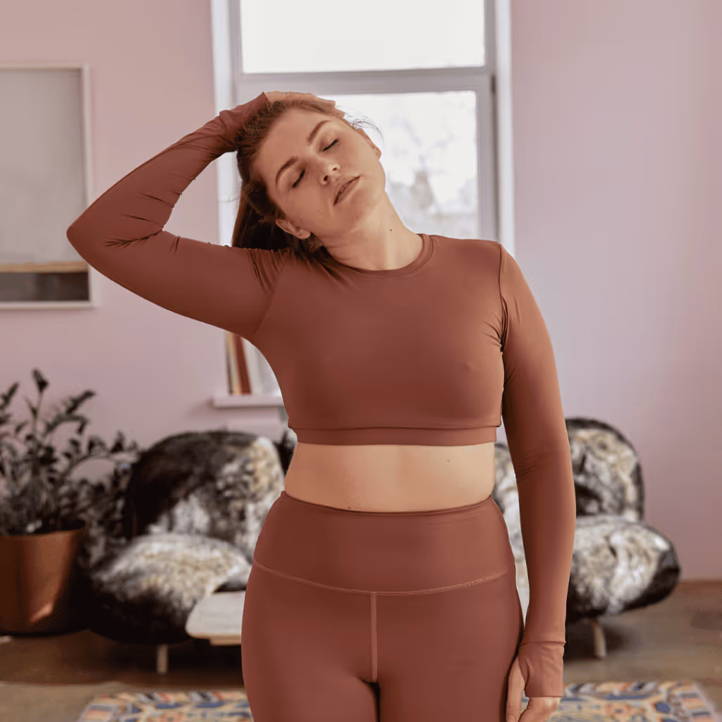 A female demonstrating a neck stretch