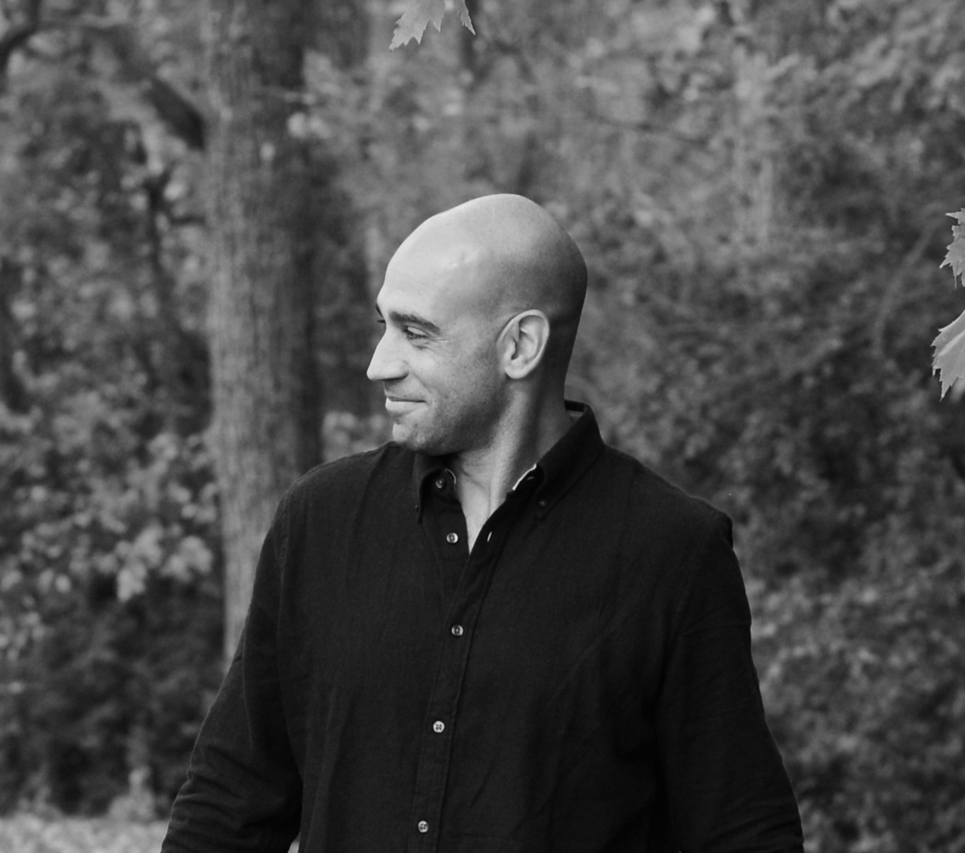 A mesmerizing long-exposure image of star trails, spiraling around a central point against a dark backdrop.