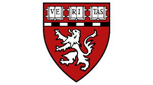 Red shield with a white lion and a white banner above showing the word VERITAS in black letters.