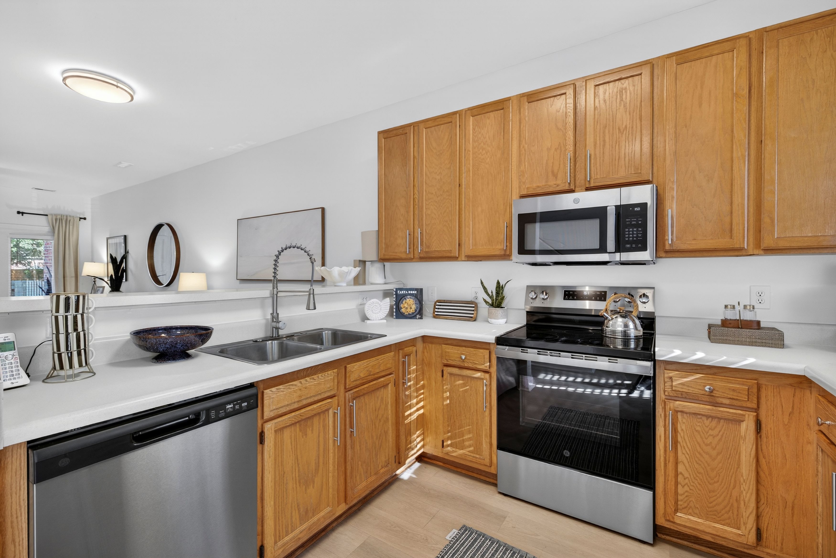 Open concept kitchen with stainless steel appliances in Wilmington, NC.