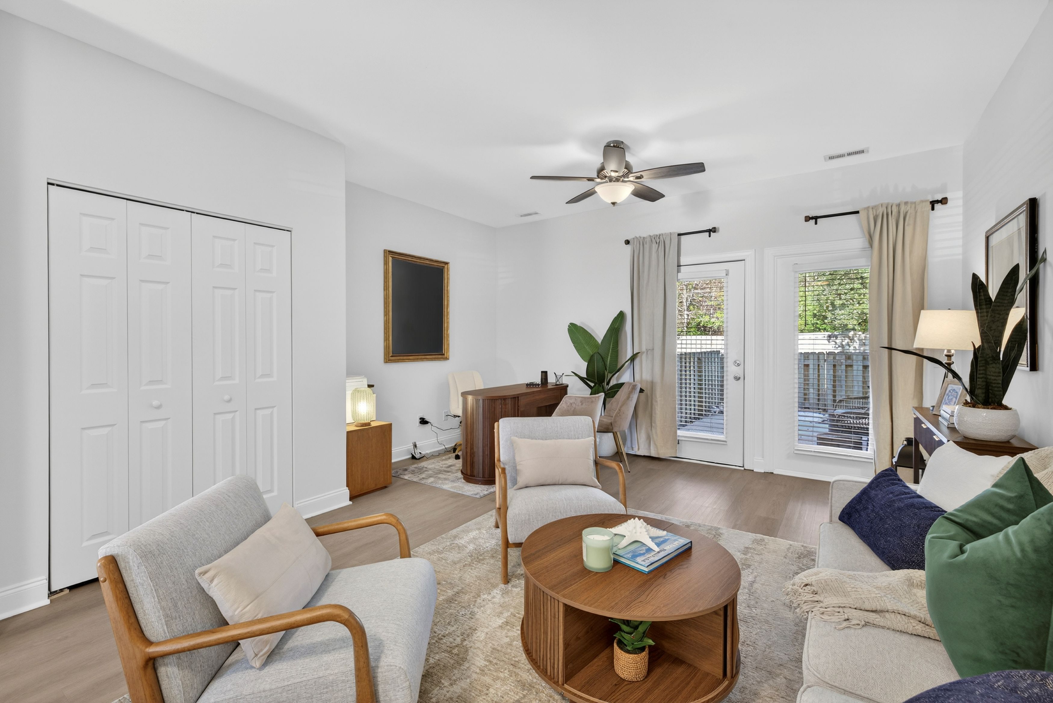 Living room with closet in 2 bedroom townhome.