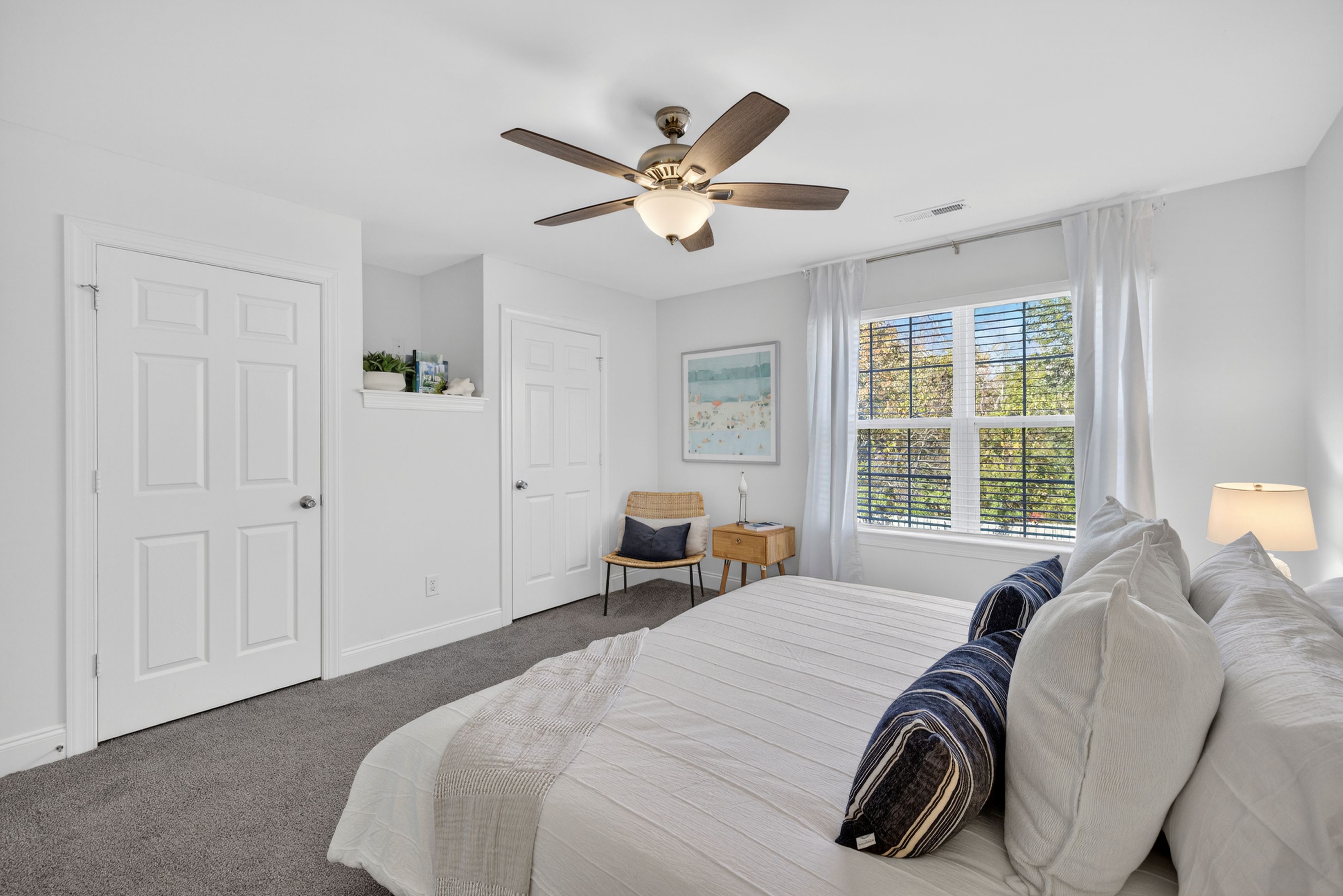 Modern bedroom with abundant space and storage at The Townes at Prior.