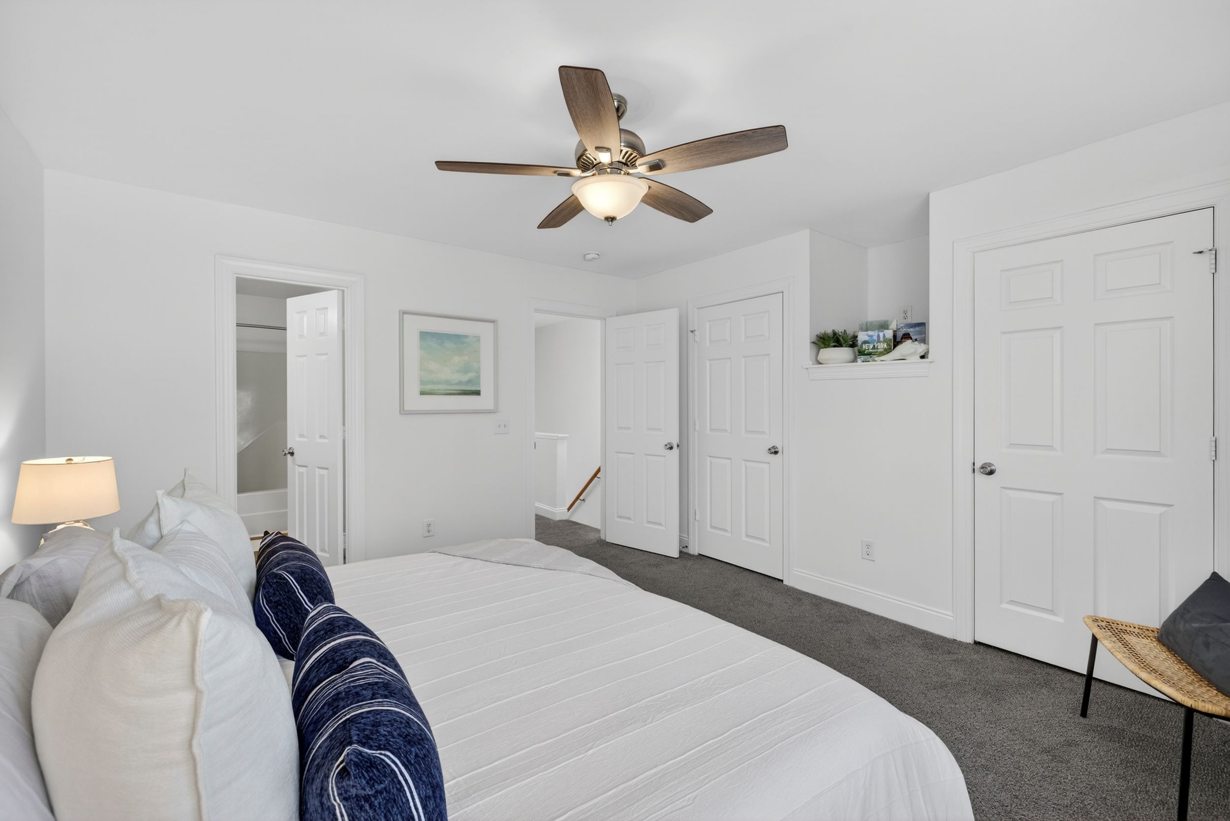 Primary bedroom with en-suite bathroom in Wilmington, NC.