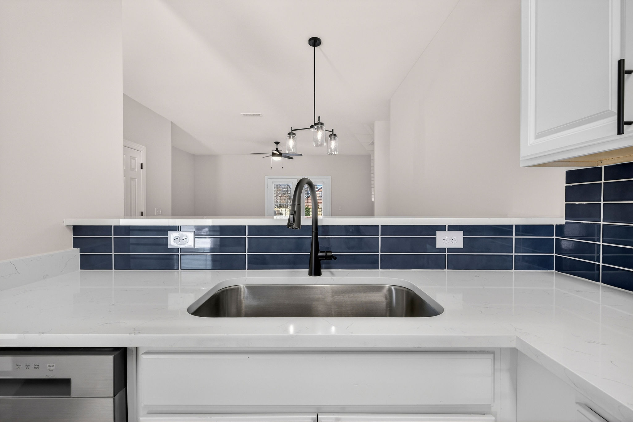 Open-concept kithen space into dining alcove