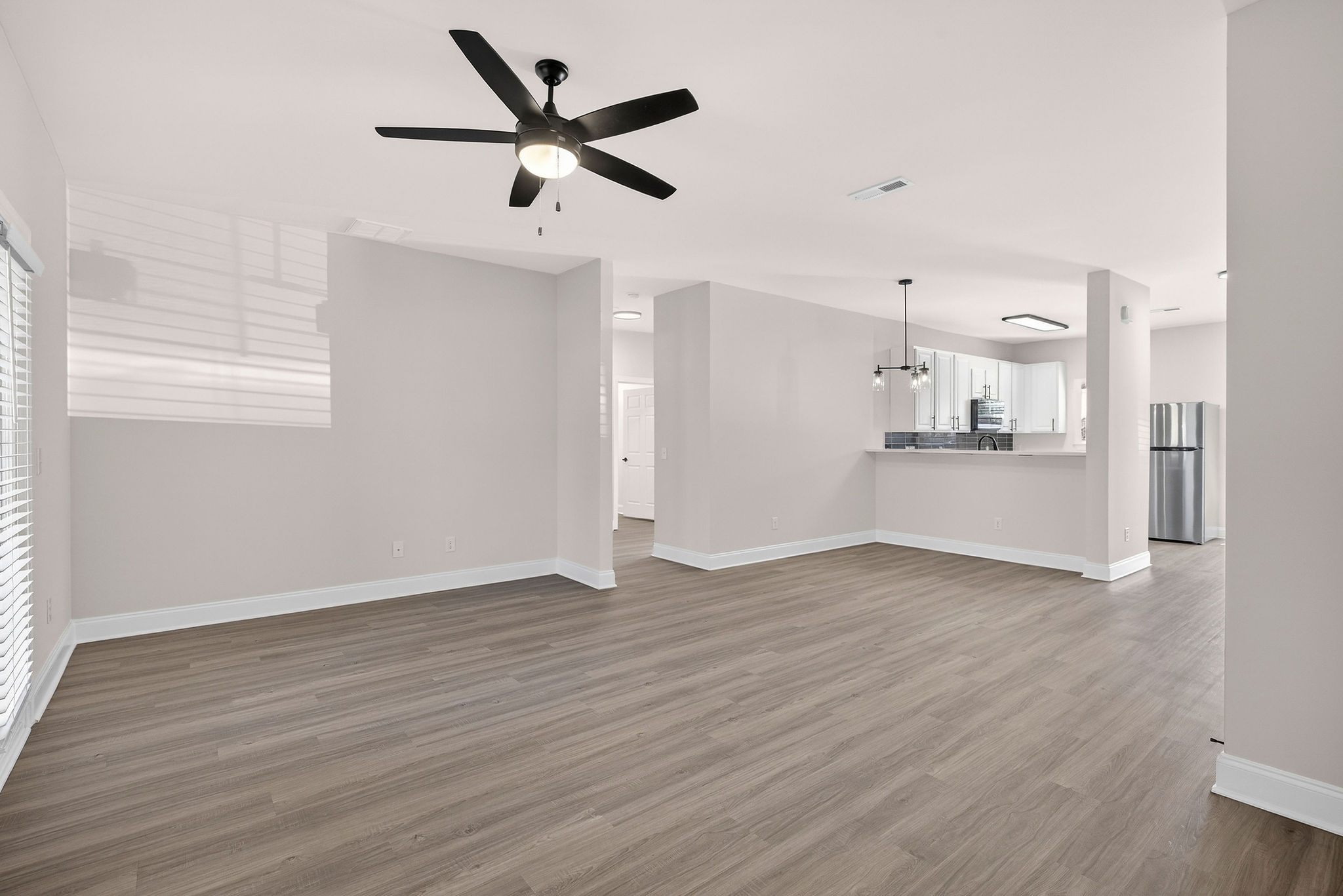 Large living room with ceiling fan