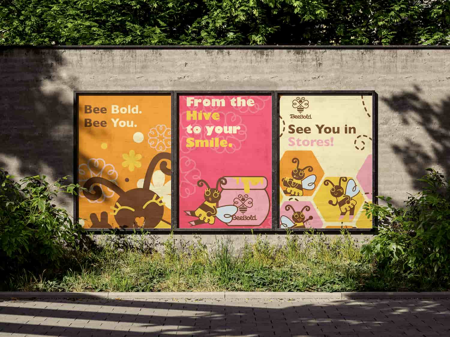 Three colorful posters side by side on a concrete wall, with bee illustrations and text: 'Bee Bold. Bee You.', 'From the Hive to your Smile.', and 'See You in Stores!'