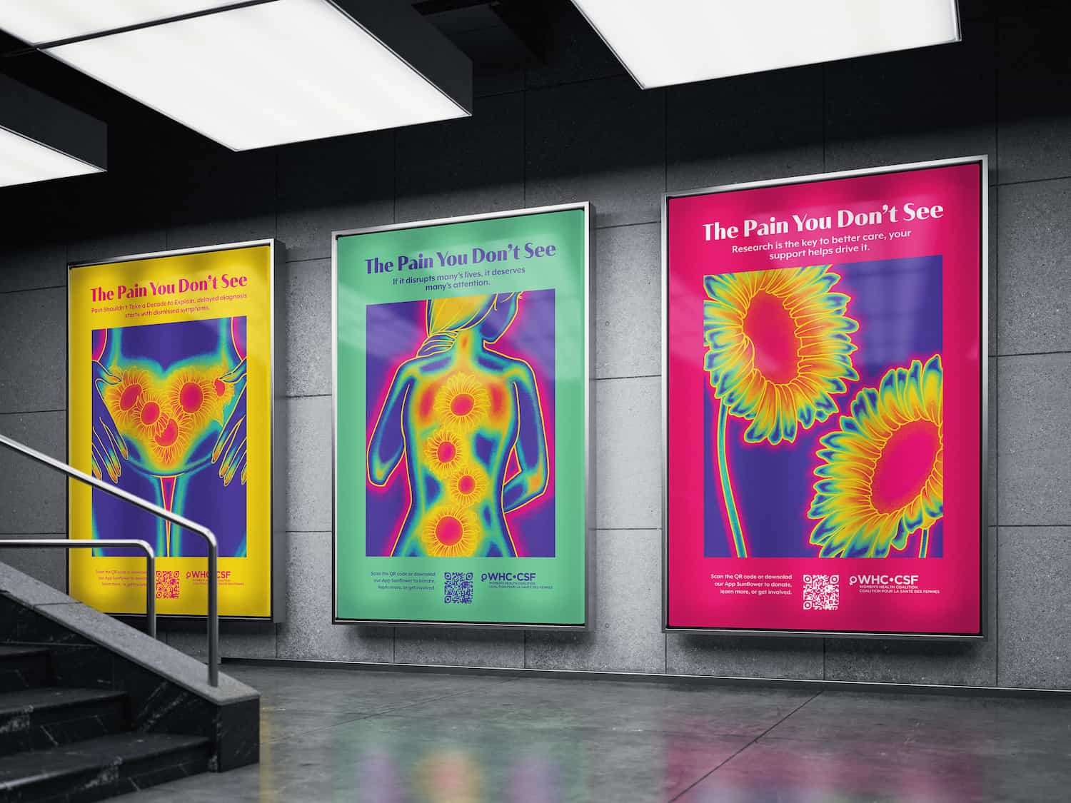 Three colorful posters displayed on a concrete wall showing thermal images highlighting pain areas with the title 'The Pain You Don’t See' and messages about pain awareness and research.