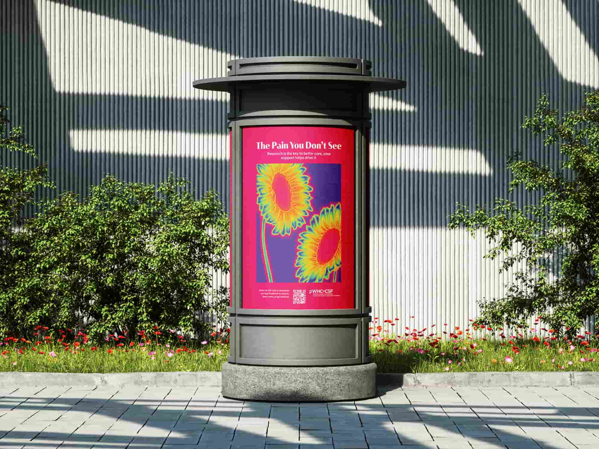 Outdoor advertisement display with a red poster featuring two sunflowers in psychedelic colors and the text 'The Pain You Don’t See'.