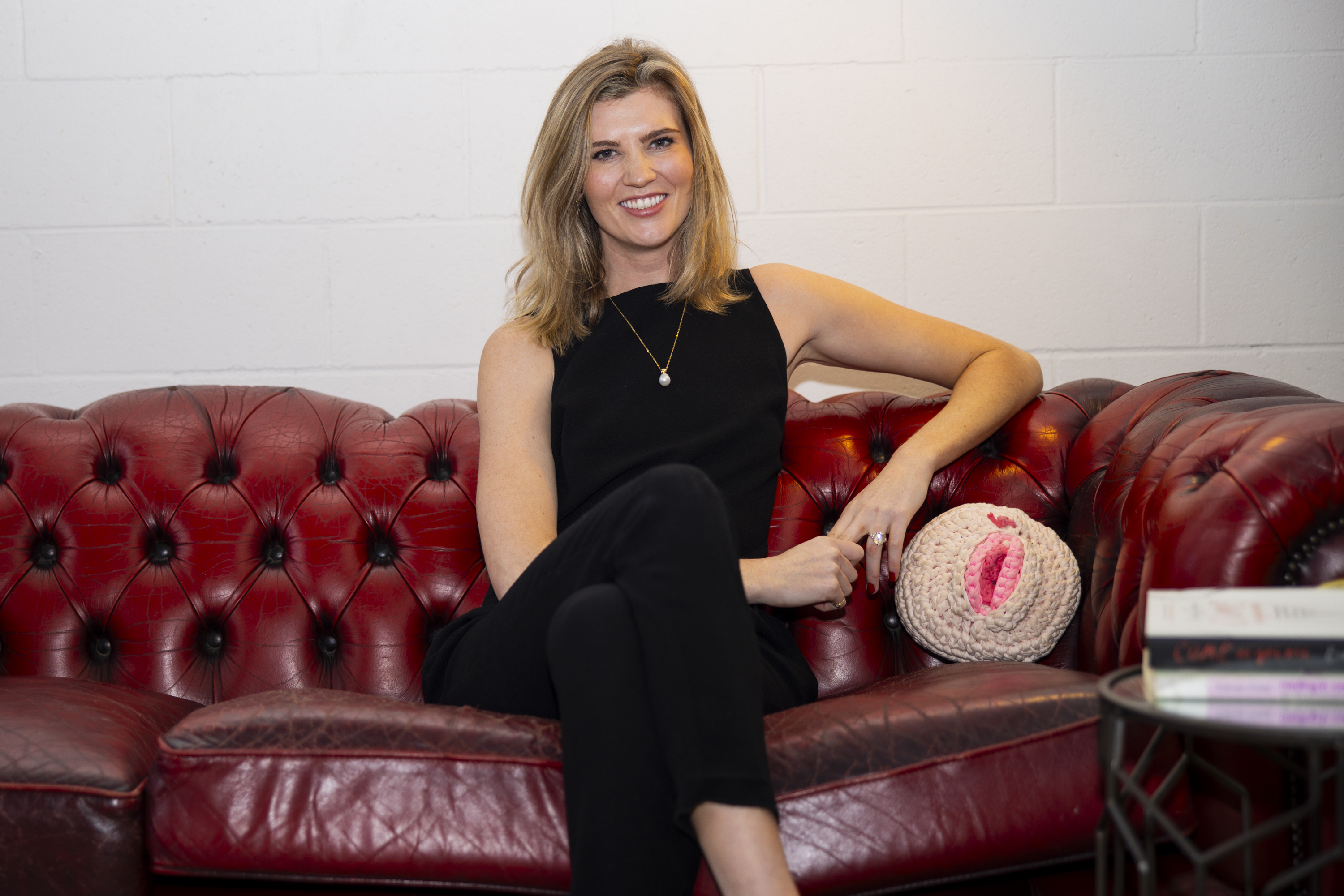 Image of Alice sitting on a sofa