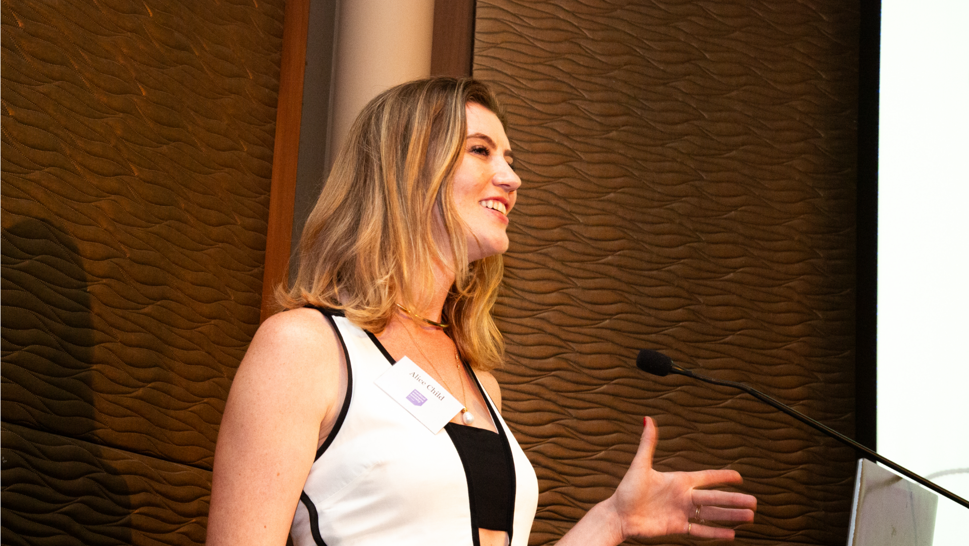Image of Alice speaking on stage