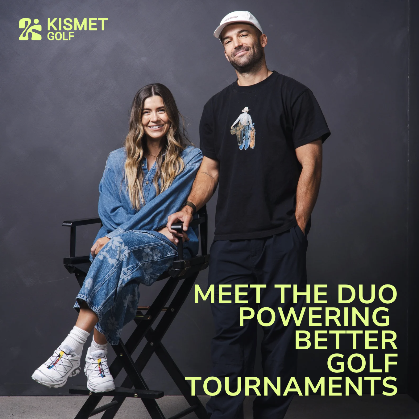 Kismet Golf founders: woman seated in director's chair and man standing, both smiling in casual attire against a studio backdrop