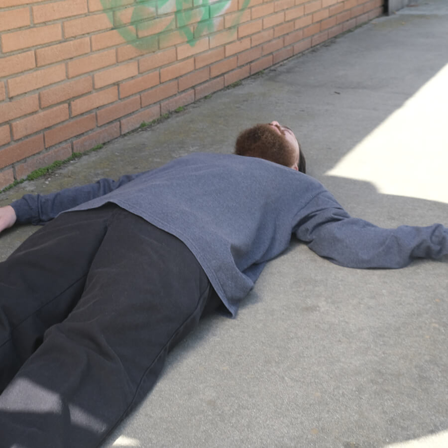 Man passed out on the sidewalk