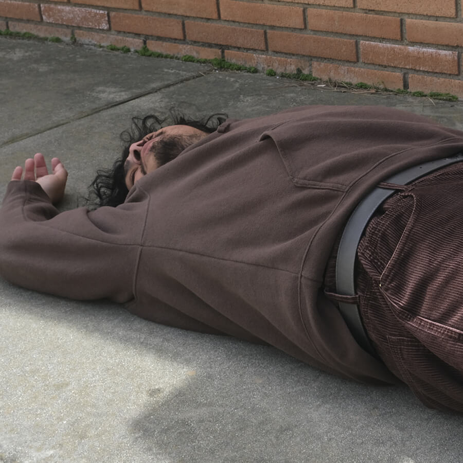 Man passed out on sidewalk