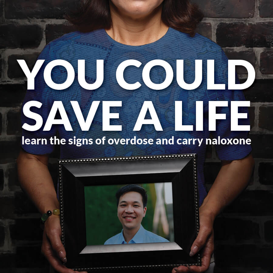 Woman holding photo of her son, with the text: "You could save a life. Learn the signs of overdose and carry naloxone"