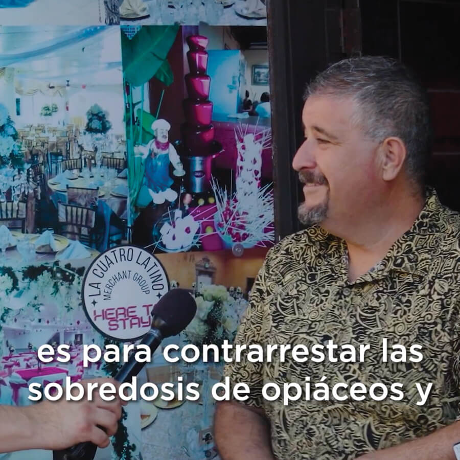 Man talking to person with microphone