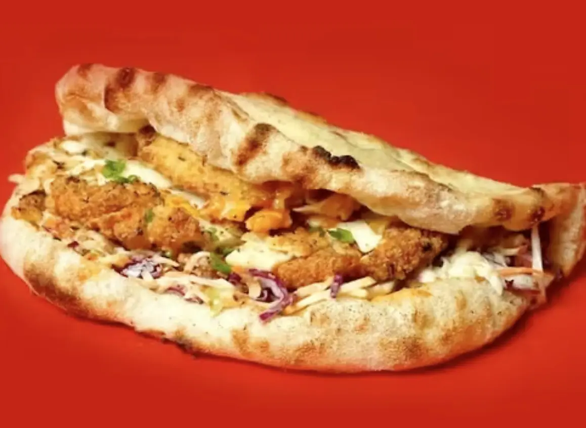 Love U Pizza crispy chicken sandwich on a red background