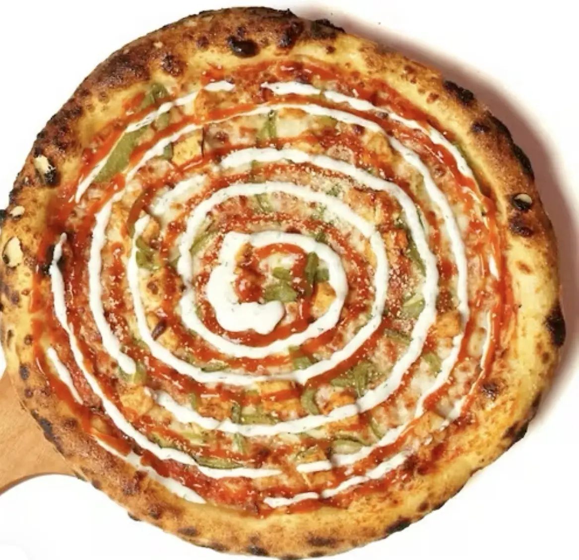 Love U Pizza finished with a creamy sauce swirl