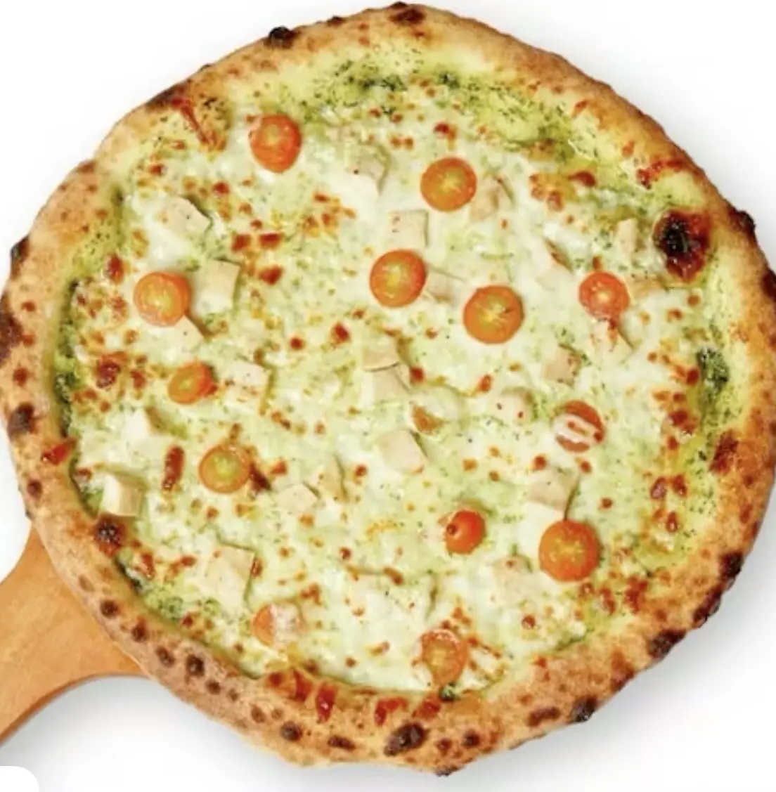 Pesto chicken pizza with cherry tomatoes and a golden crust