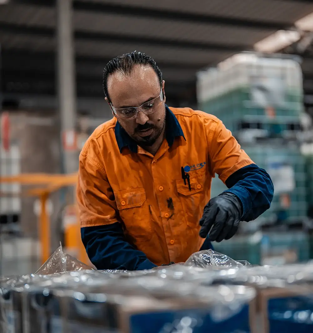 a team member preparing an enviro pack package
