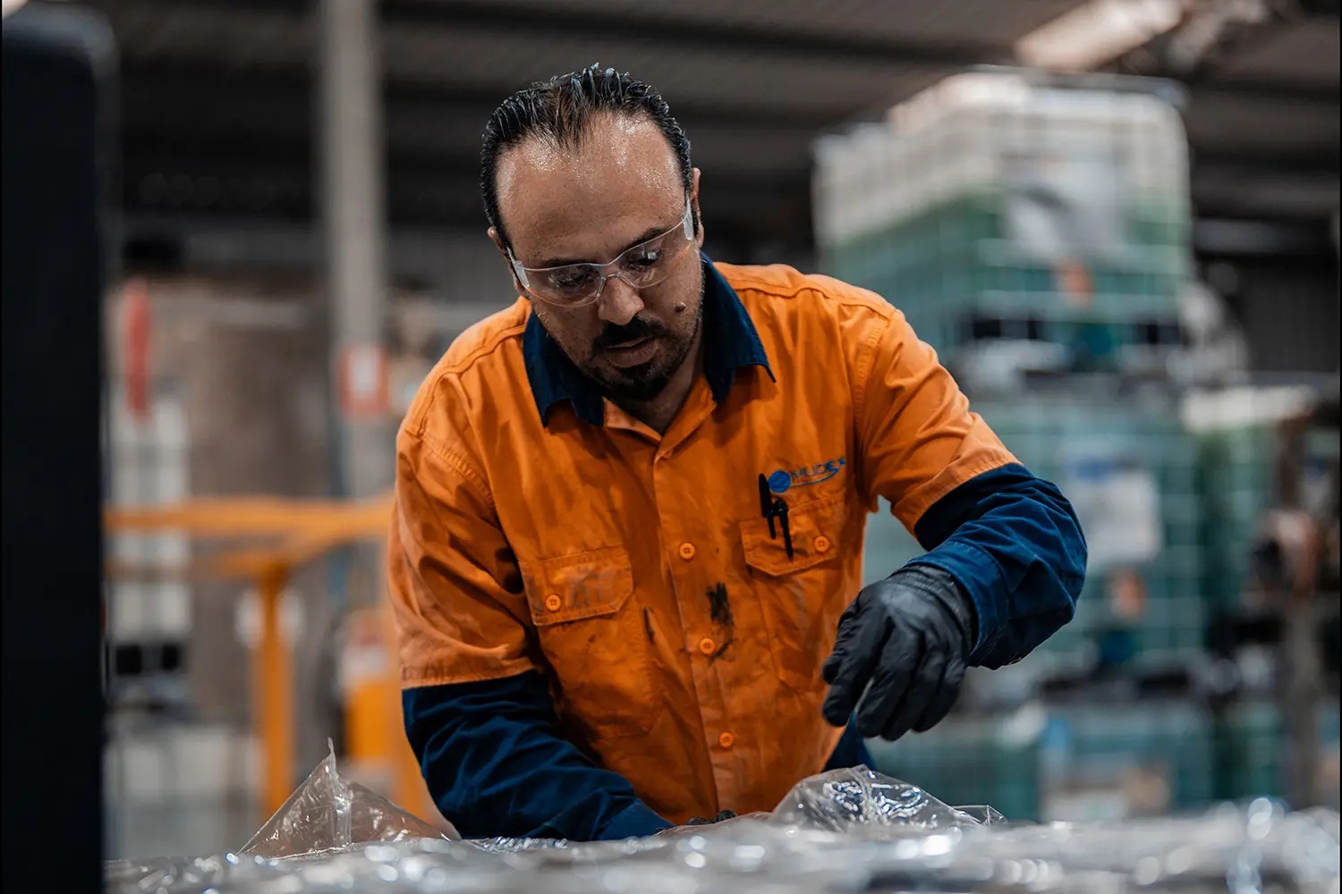 a team member preparing an enviro pack package