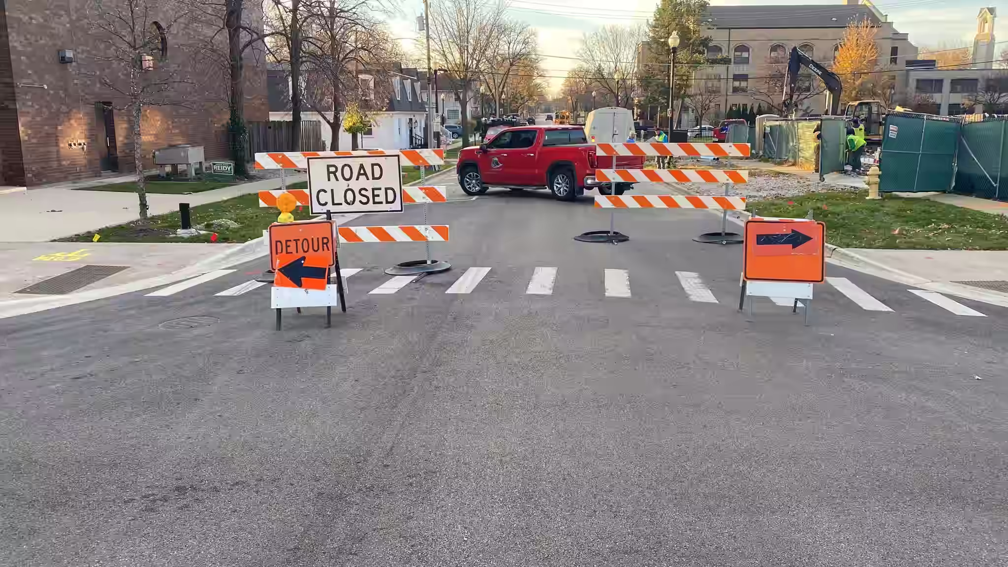 Donegal Services managing a road closure in Wheaton with barricades, detour signs, and traffic safety equipment.
