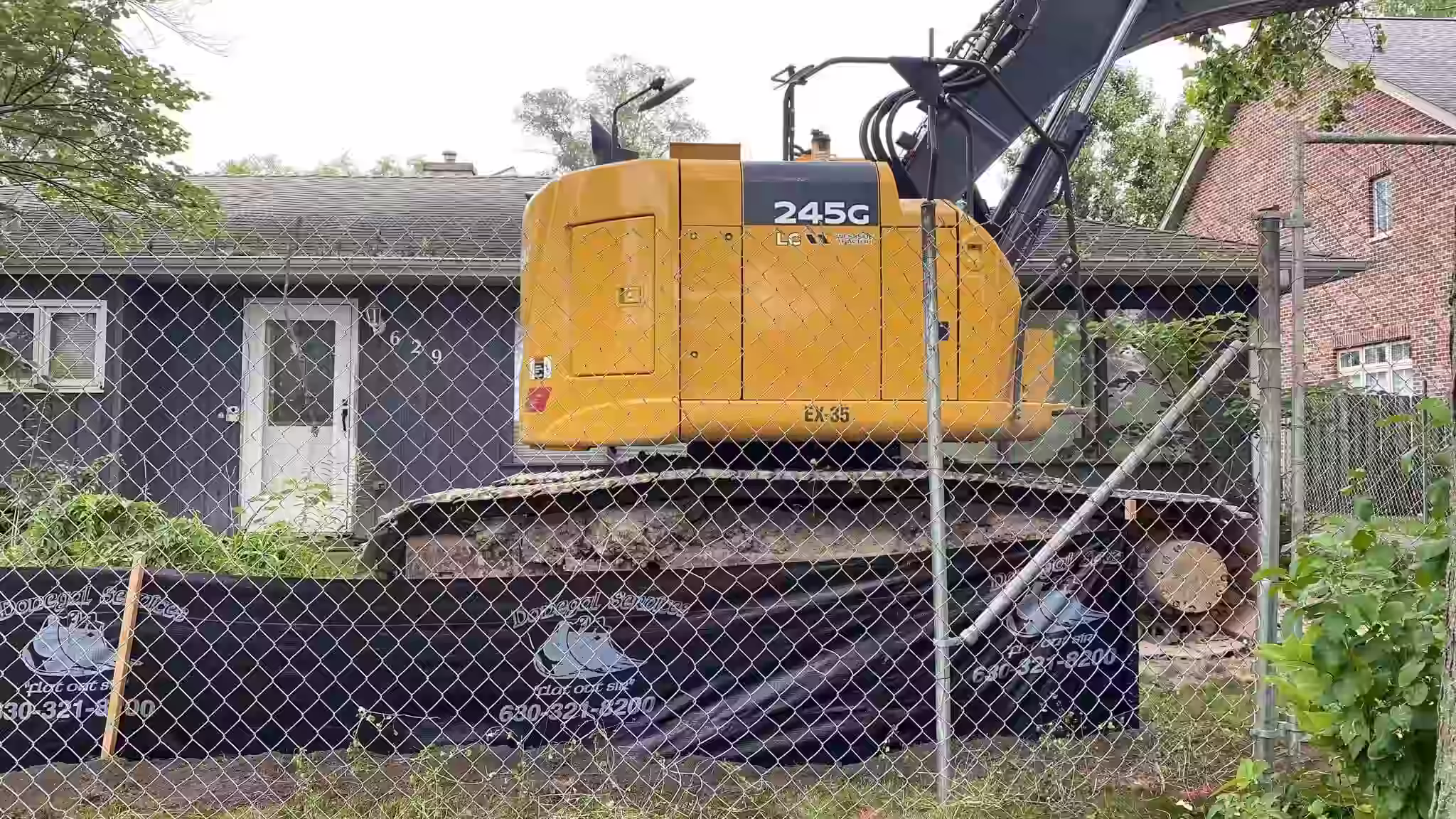 Donegal Services installing silt fencing around a residential excavation site for erosion control and stormwater compliance.