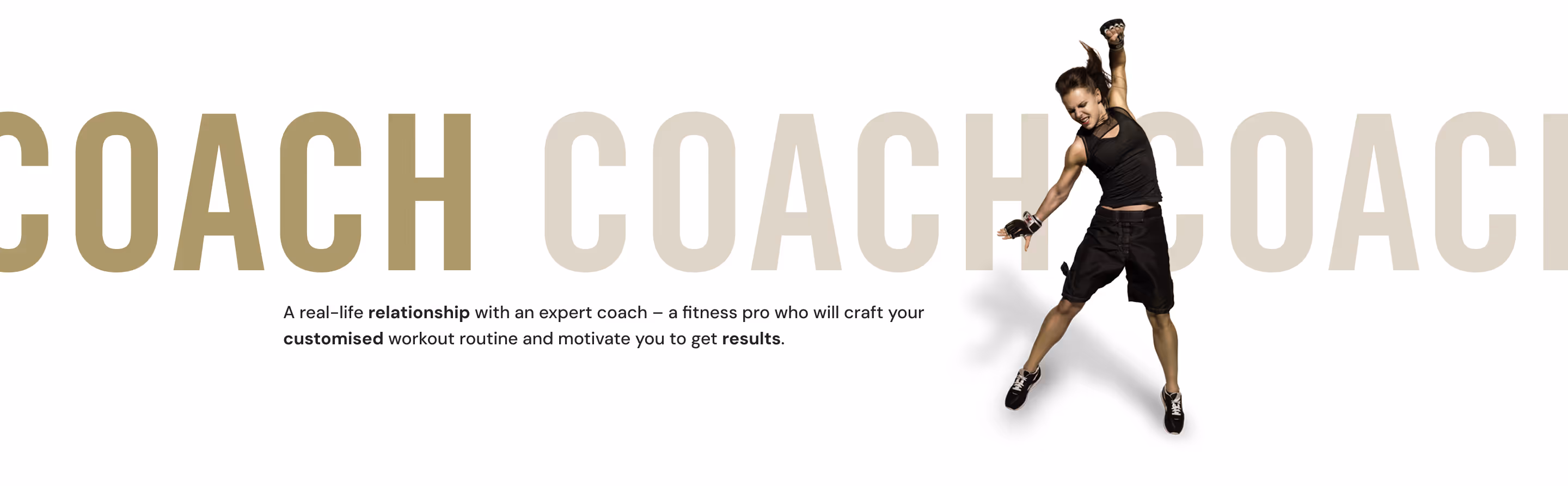 Energetic woman in black workout clothes jumping with one arm raised against a white background with large faint text reading 'COACH'.