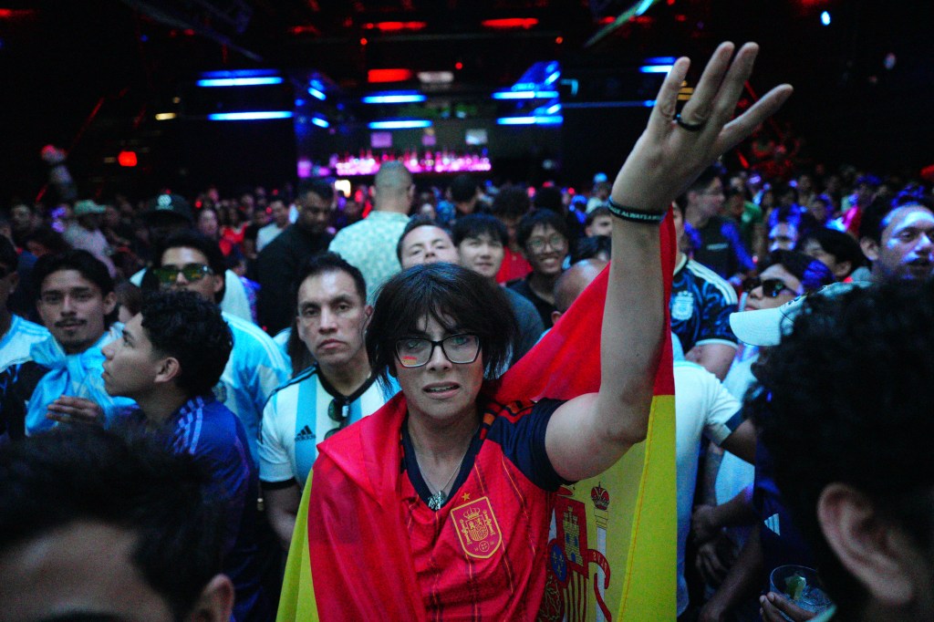 A Spain supporter watches the FIFA World Cup final at Nebula Nightclub in New York City.