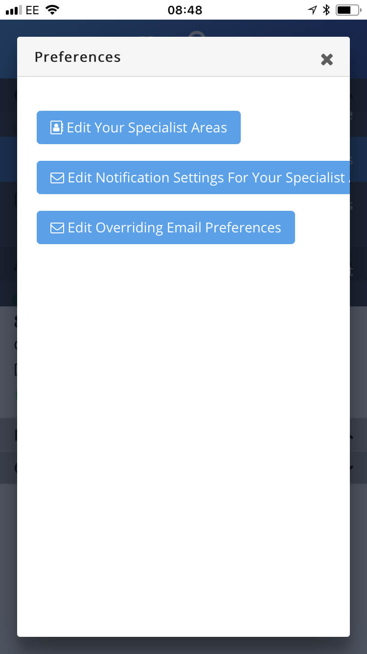 Mobile screen showing a Preferences popup with three blue buttons: Edit Your Specialist Areas, Edit Notification Settings For Your Specialist, and Edit Overriding Email Preferences.
