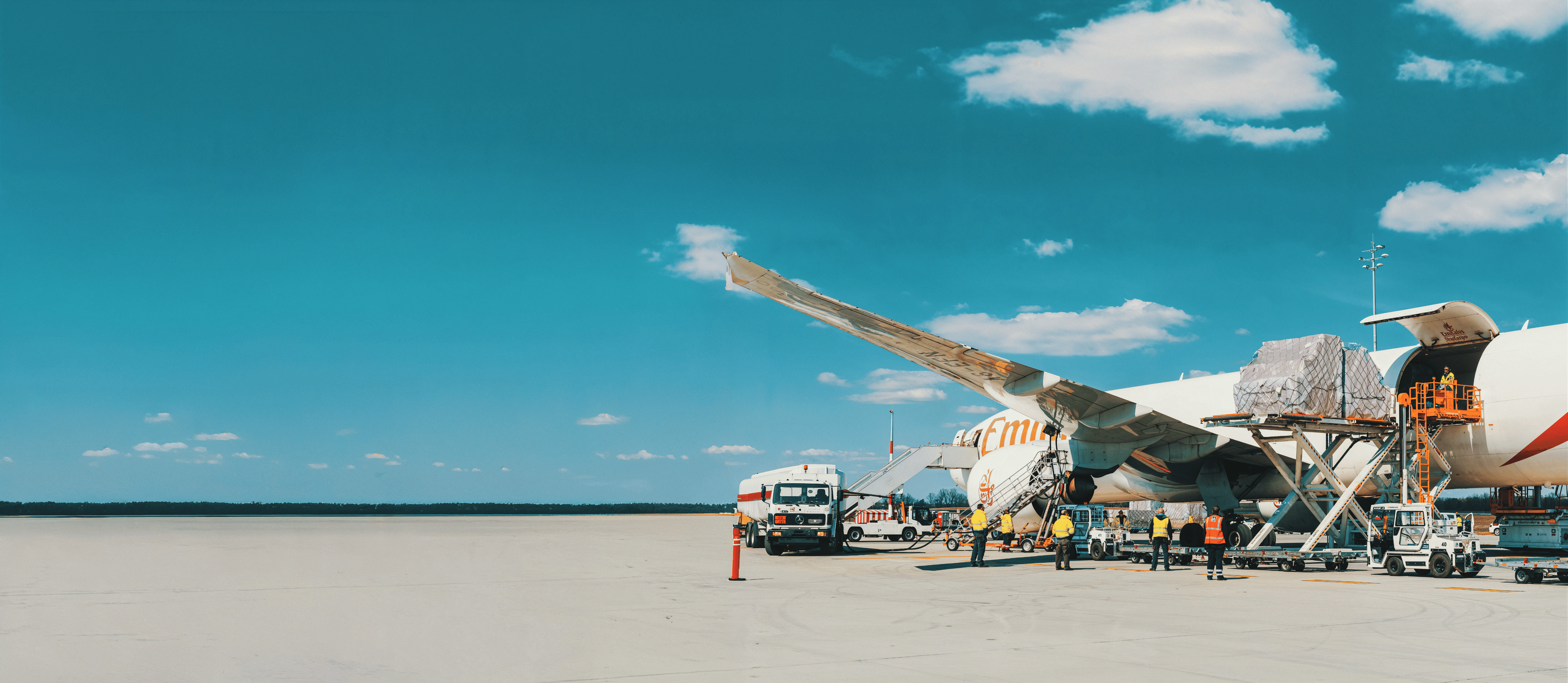 A full freighter aircraft on the apron being loaded for a dedicated charter