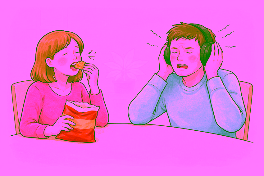 Illustratie van misofonie: een vrouw eet chips aan tafel, terwijl een man tegenover haar met een koptelefoon op zijn oren drukt en zichtbaar gespannen reageert op het eetgeluid