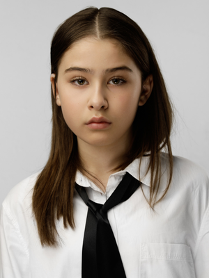 Seraphine Krystek Portfolio picture wearing white shirt.