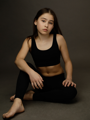 Seraphine Krystek Head shot sitting down in workout wear