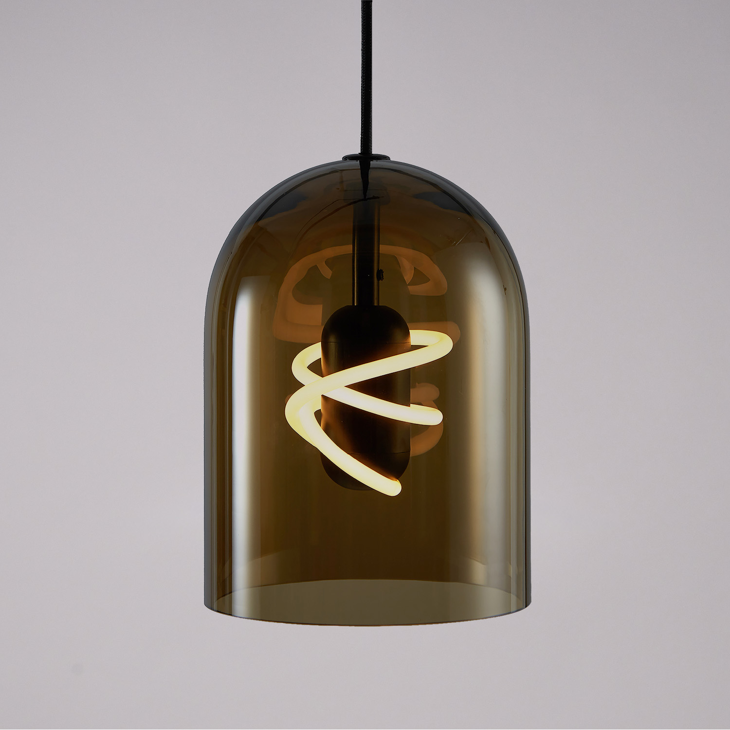 BEEM Capo glass pendant with an illuminated spiral bulb.