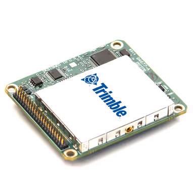 Trimble electronic circuit board module with multiple connectors and components on a white background.