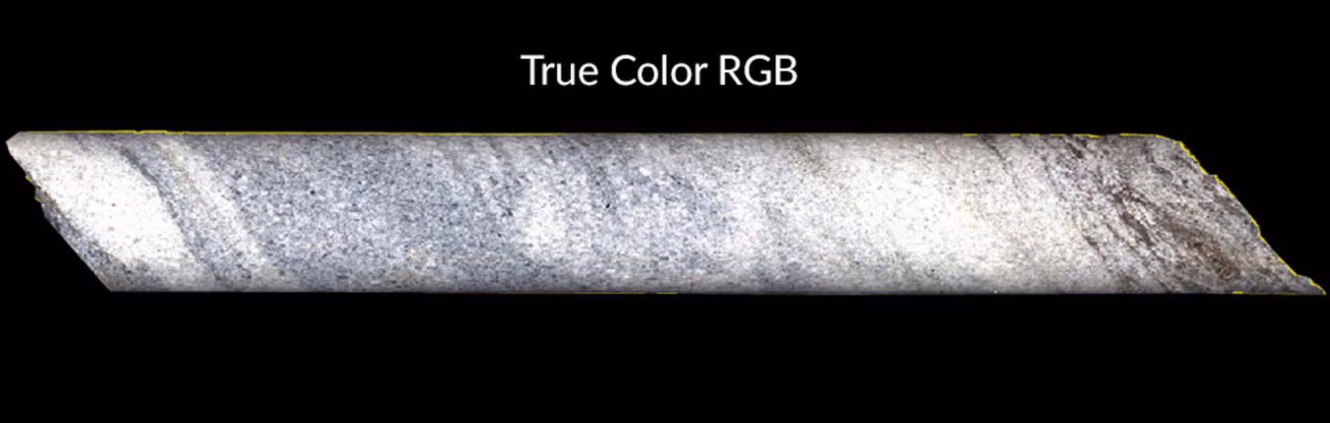 Long cylindrical core sample with gray and white layers labeled True Color RGB.