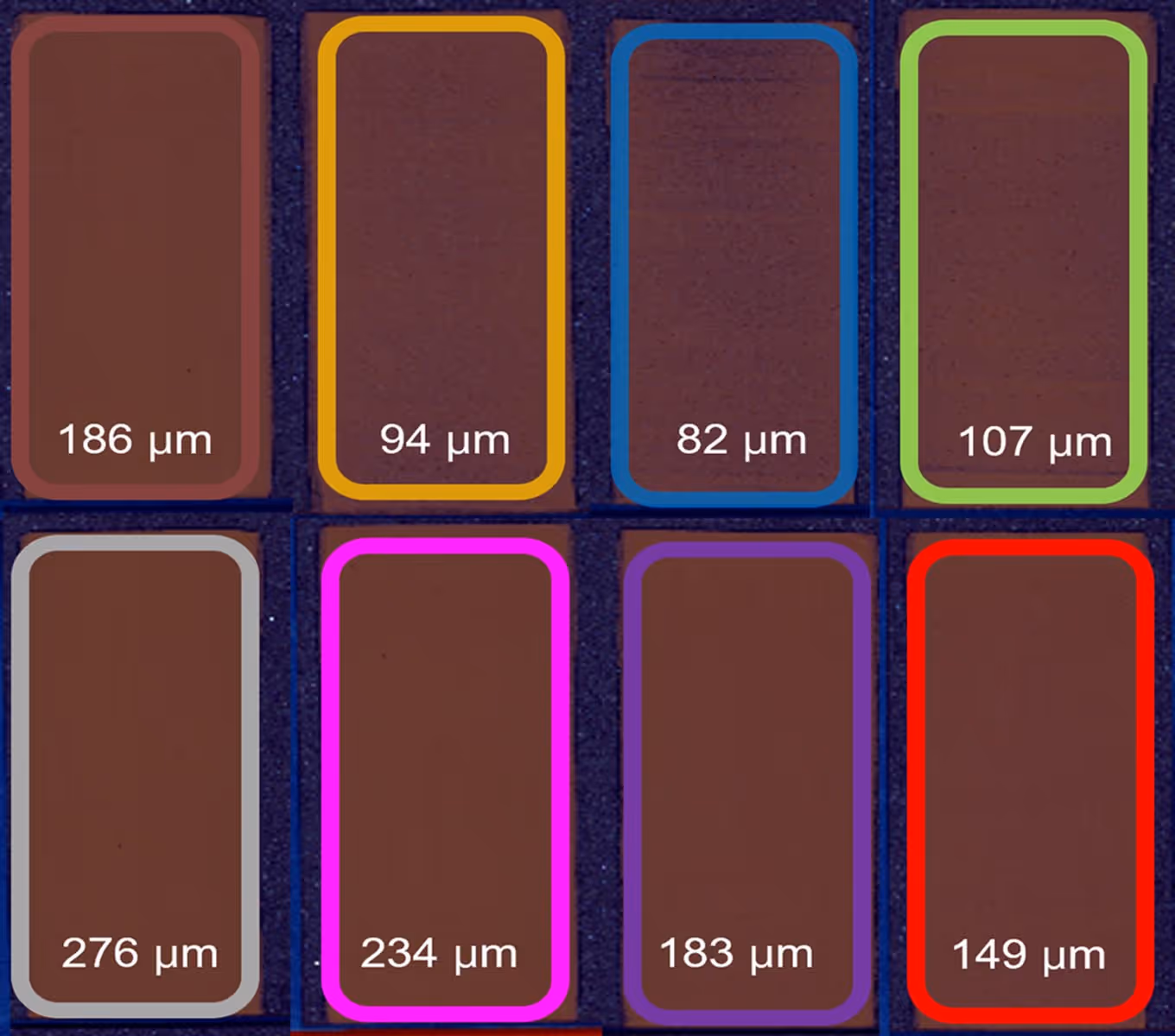 Microscopic image showing eight rectangular brown samples outlined in different colors, each labeled with sizes ranging from 82 to 276 micrometers.