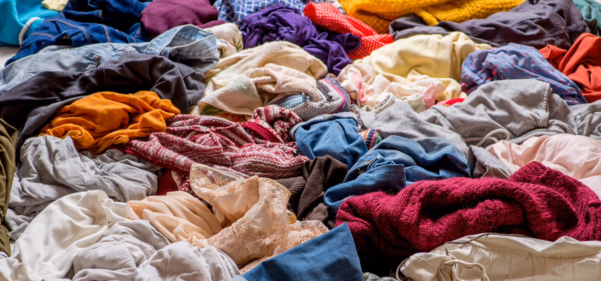 Various clothes and textiles in a pile