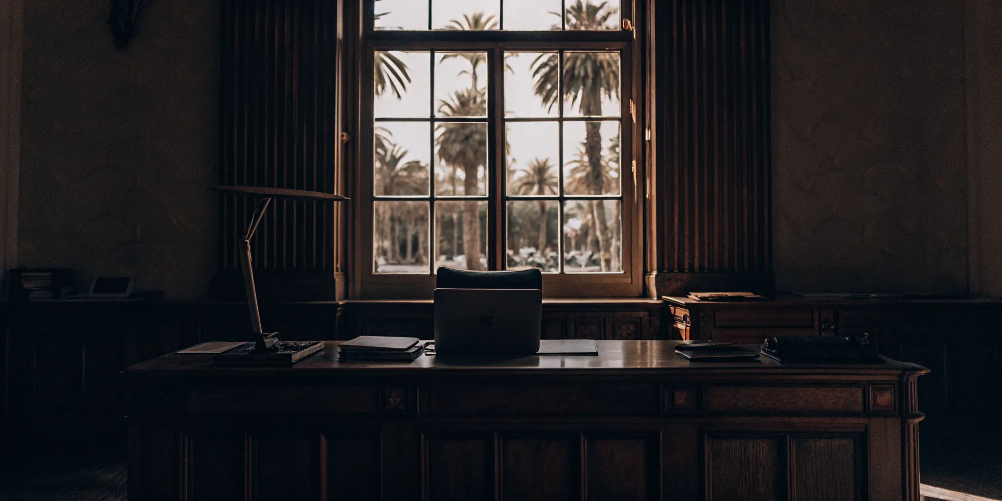 Landlord's desk with a laptop showing a Florida tenant credit check report.