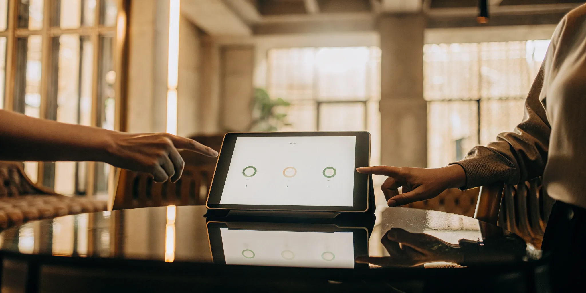 A renter shares their paid tenant screening report with a landlord on a tablet.