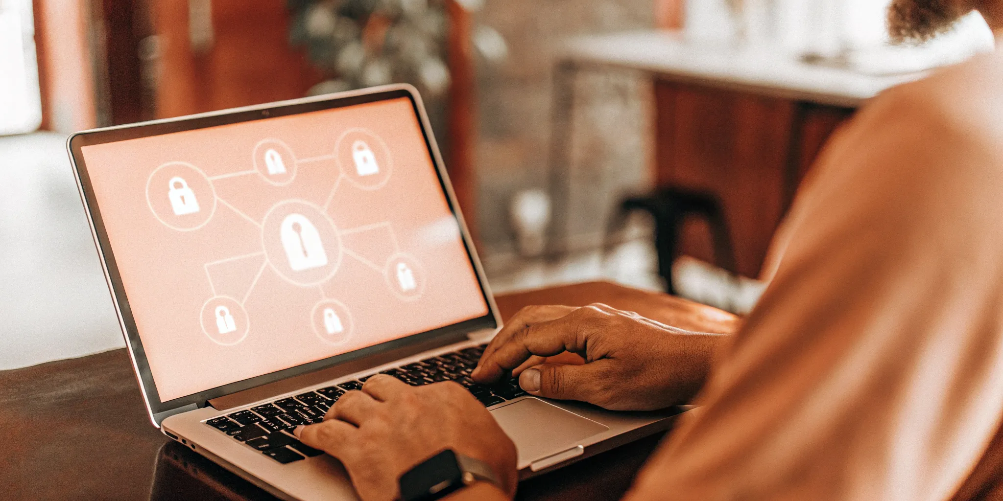 A renter using a laptop to get their own screening report online.