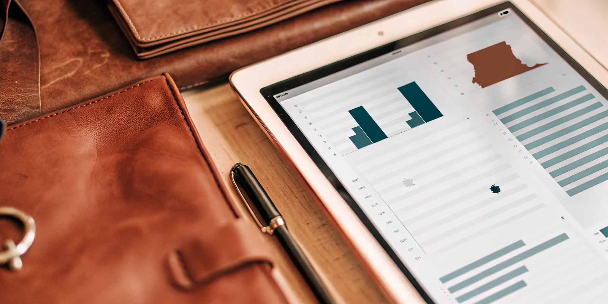A tablet displaying a Maryland reusable tenant screening report with financial charts.